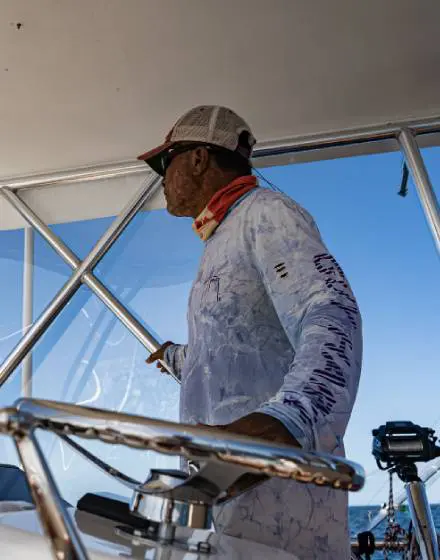 Local, bilingual captain in fishing action